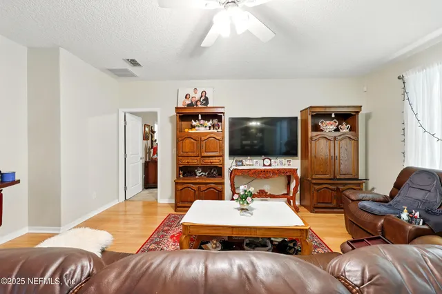 a bed room with a bed and a television