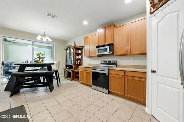 a bathroom with a double vanity sink toilet mirror and shower