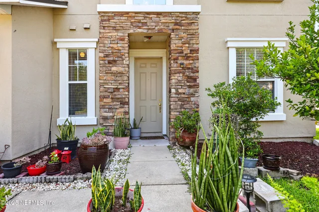 a front view of a house with outdoor seating