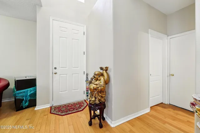 a room that has a bed and a chair in it