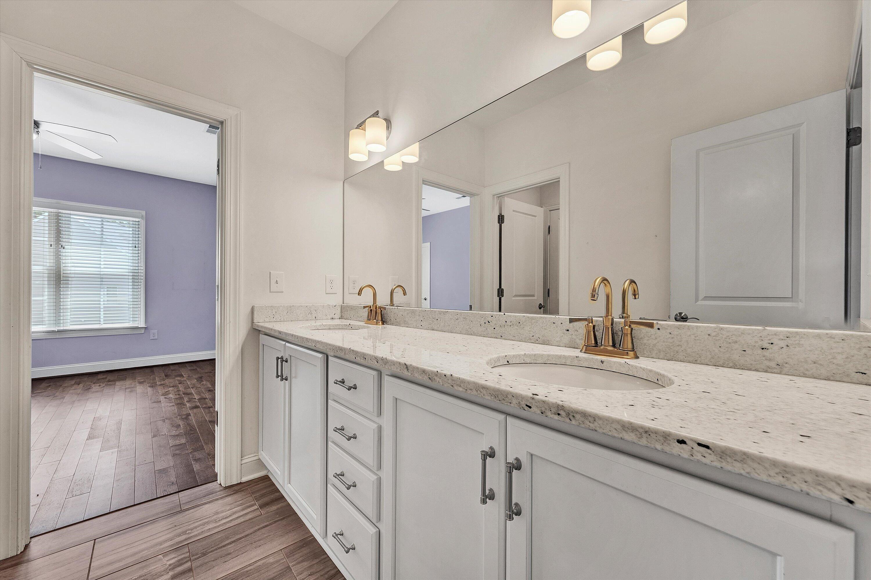 6981 Fairway Ridge Road Salem, VA 24153 - Photo 34 of 53 a spacious bathroom with a granite countertop double vanity sink and a mirror