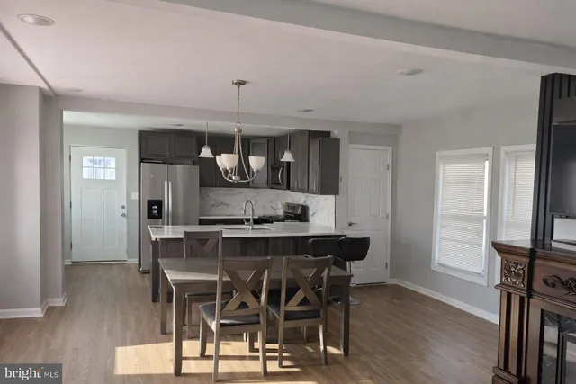 a kitchen with a sink and a stove
