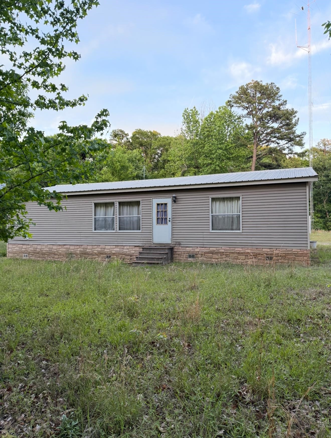 990 River Road Bolivar, TN 38008 - Photo 2 of 5 a backyard of a house with lots of green space