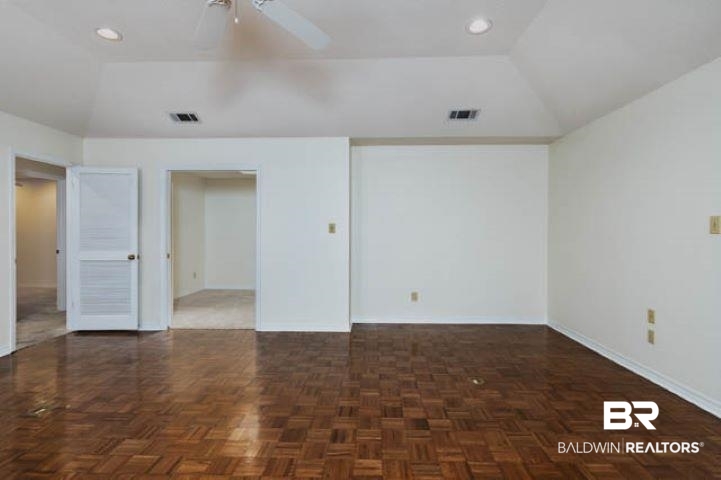12 Stonebridge Court Mobile, AL 36608 - Photo 10 of 38 Spare room featuring a ceiling fan, vaulted ceiling, and recessed lighting