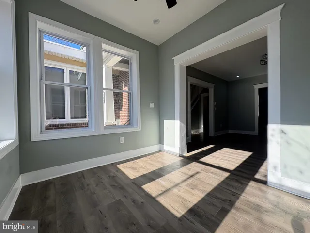 a view of an empty room with glass door
