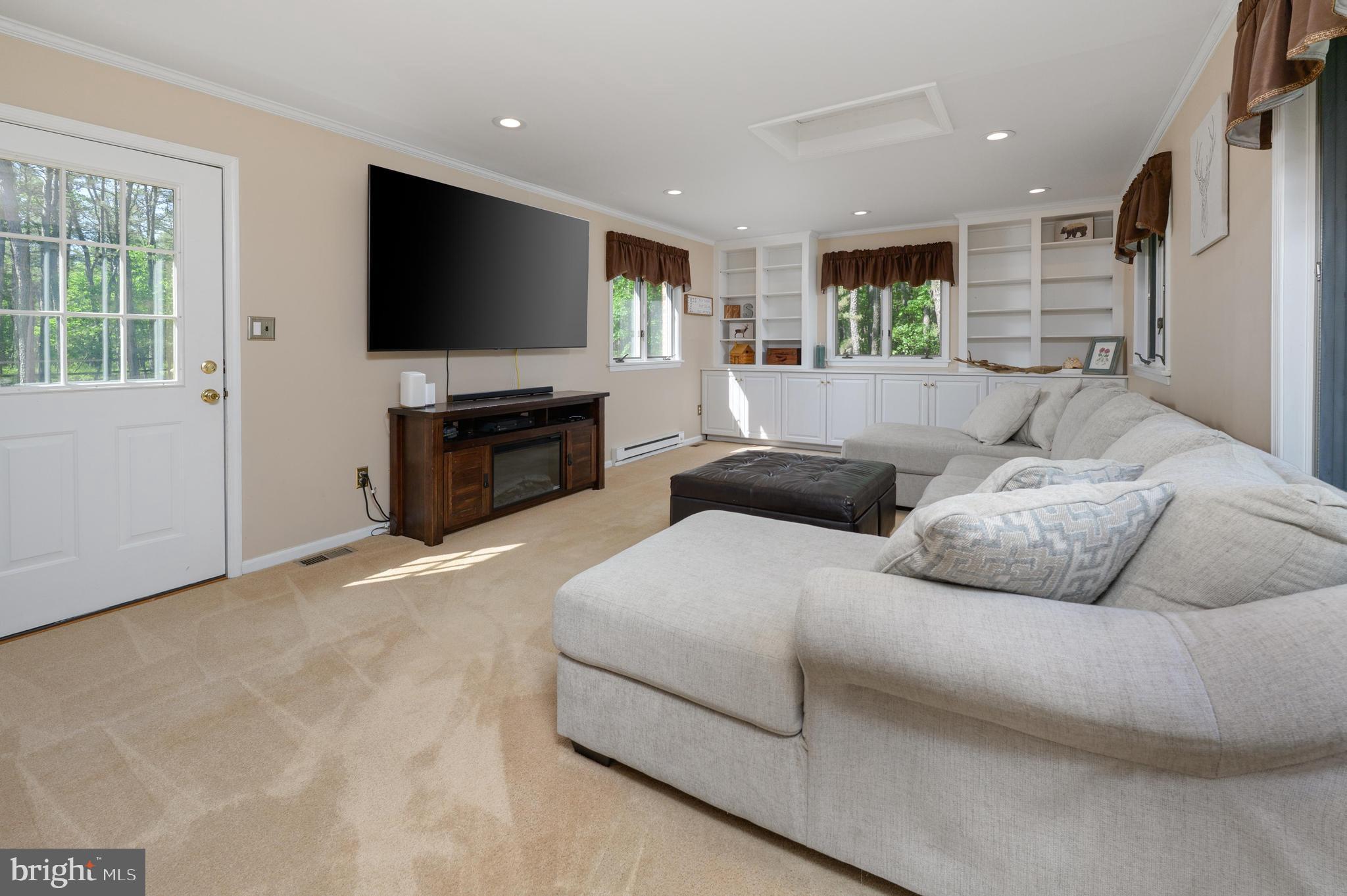 16 Sawmill Road Medford, NJ 08055 - Photo 13 of 37 a living room with furniture and a flat screen tv