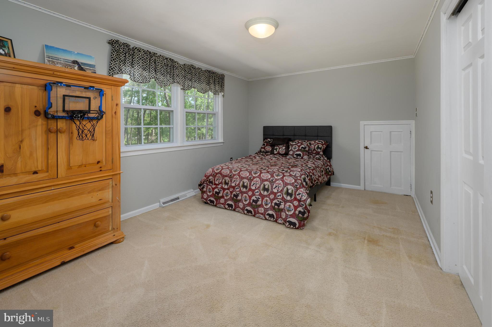 16 Sawmill Road Medford, NJ 08055 - Photo 17 of 37 a room with a bed and a window