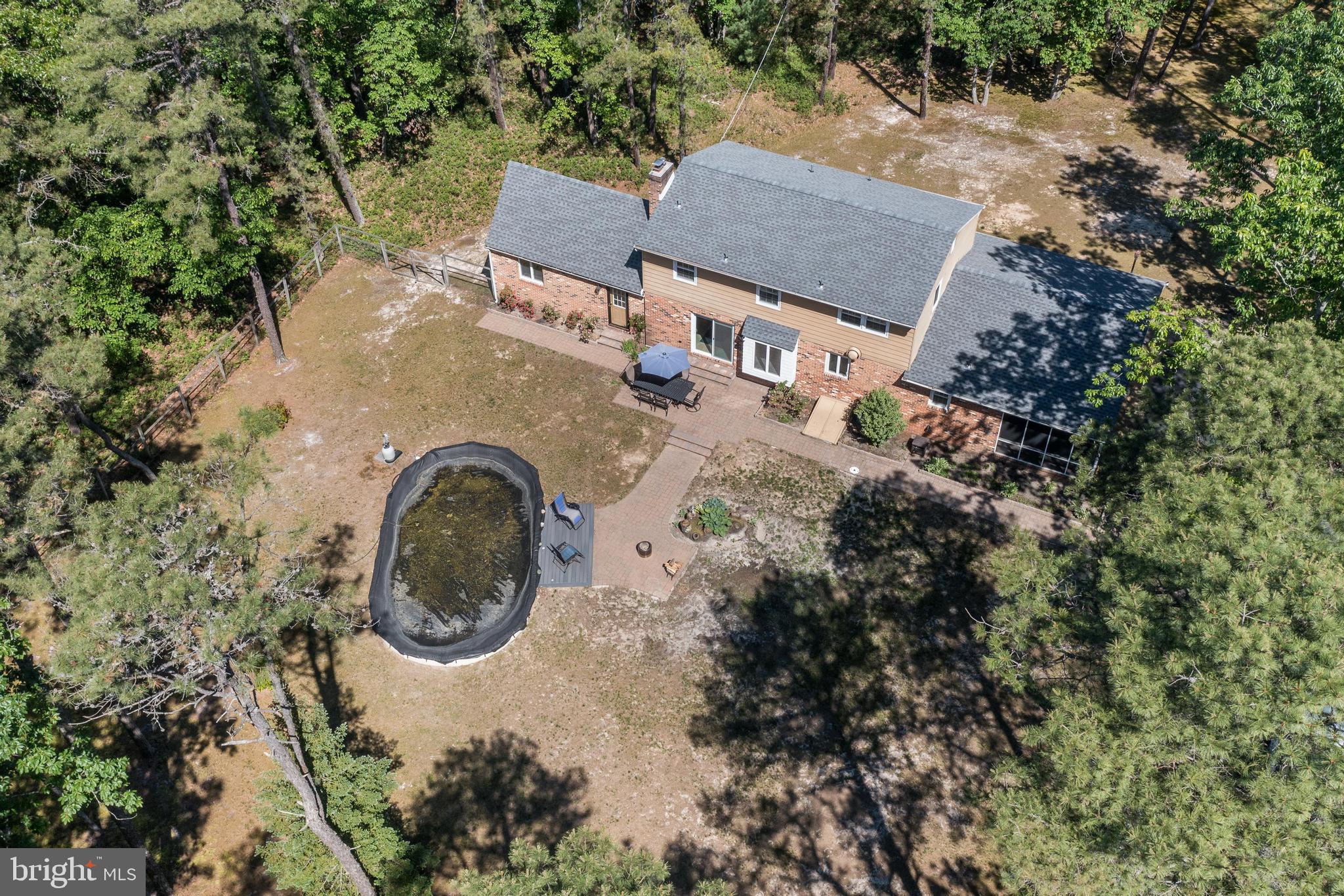 16 Sawmill Road Medford, NJ 08055 - Photo 32 of 37 an aerial view of a house with garden space and trees all around