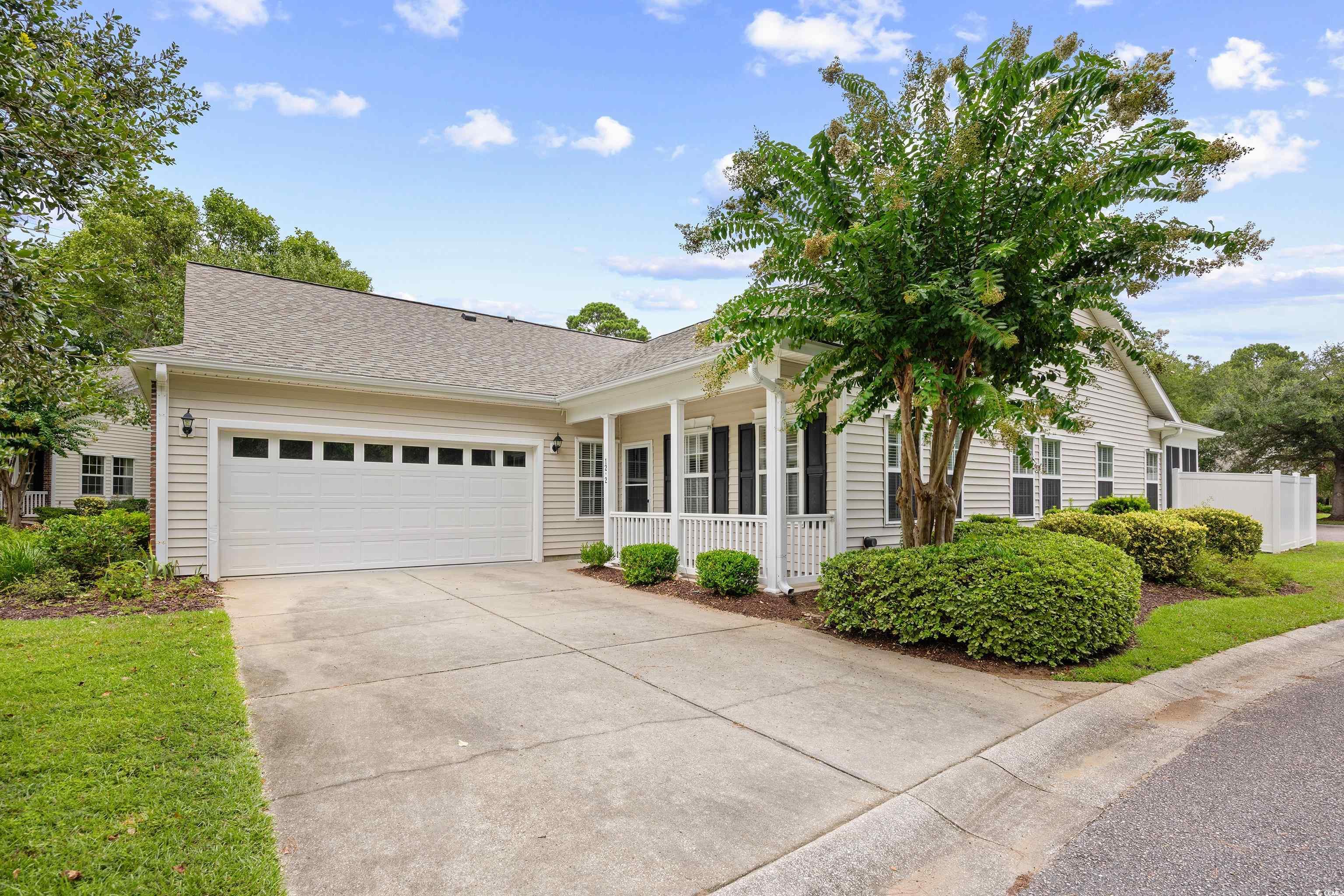 12-2 Rapture Court, Unit 2 Pawleys Island, SC 29585 - Photo 1 of 40 View of front of home with a shingled roof, drivew
