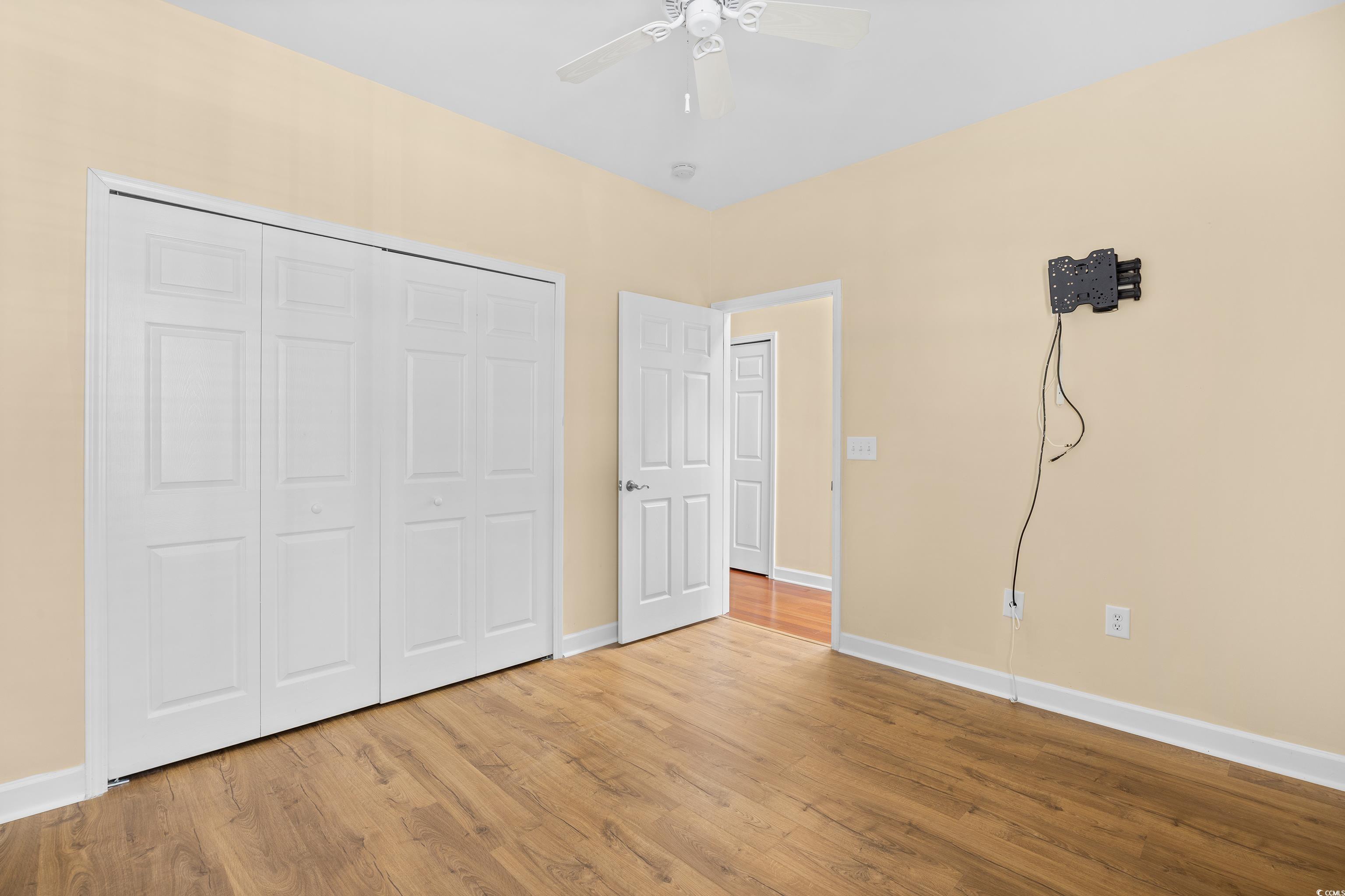12-2 Rapture Court, Unit 2 Pawleys Island, SC 29585 - Photo 23 of 40 Unfurnished bedroom with wood finished floors, a c