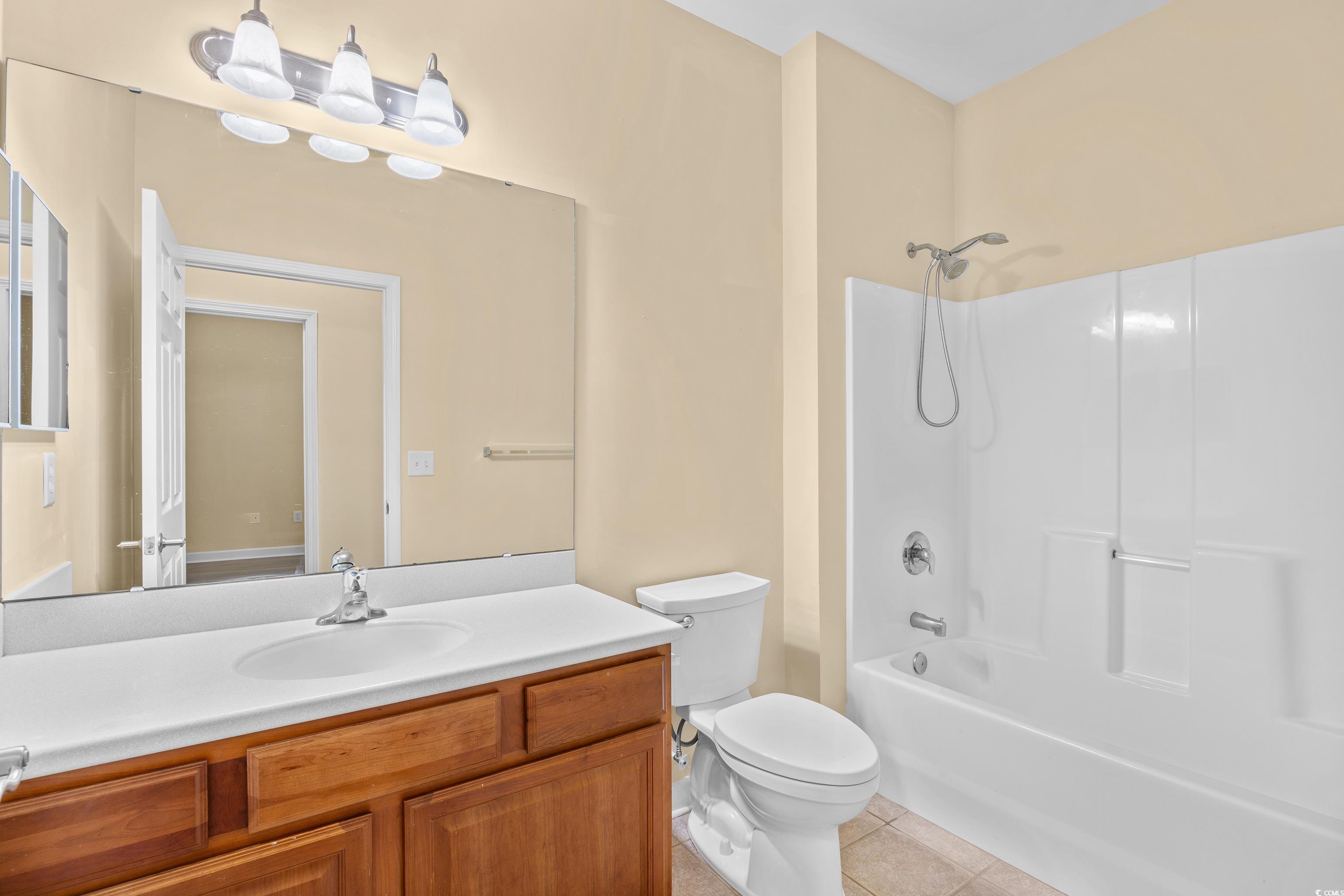 12-2 Rapture Court, Unit 2 Pawleys Island, SC 29585 - Photo 24 of 40 Full bath with tile patterned flooring, vanity, an