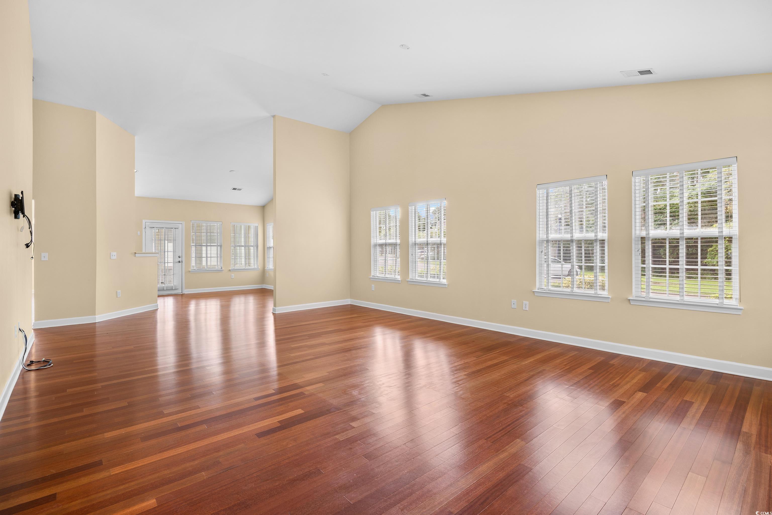 12-2 Rapture Court, Unit 2 Pawleys Island, SC 29585 - Photo 3 of 40 Unfurnished living room featuring hardwood / wood-