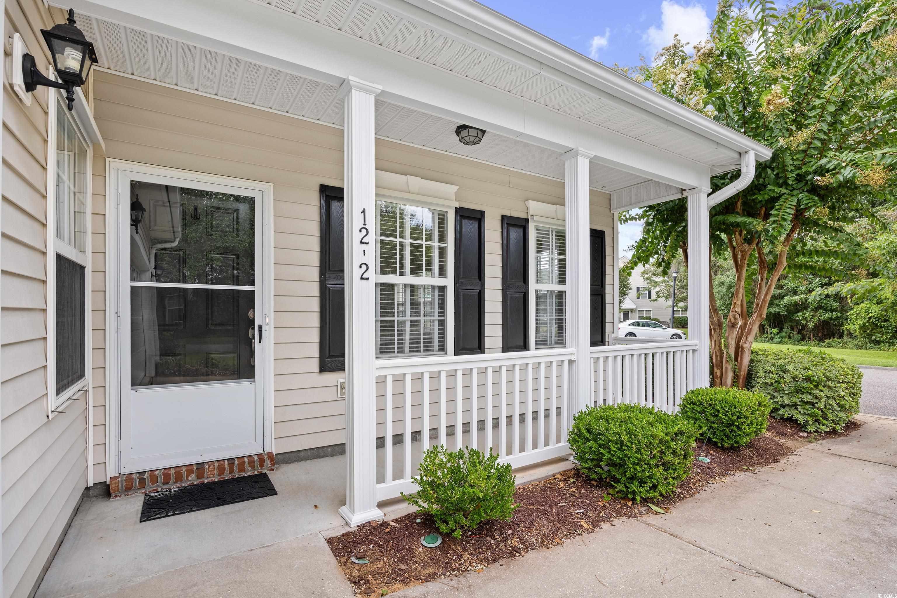 12-2 Rapture Court, Unit 2 Pawleys Island, SC 29585 - Photo 36 of 40 View of exterior entry featuring covered porch