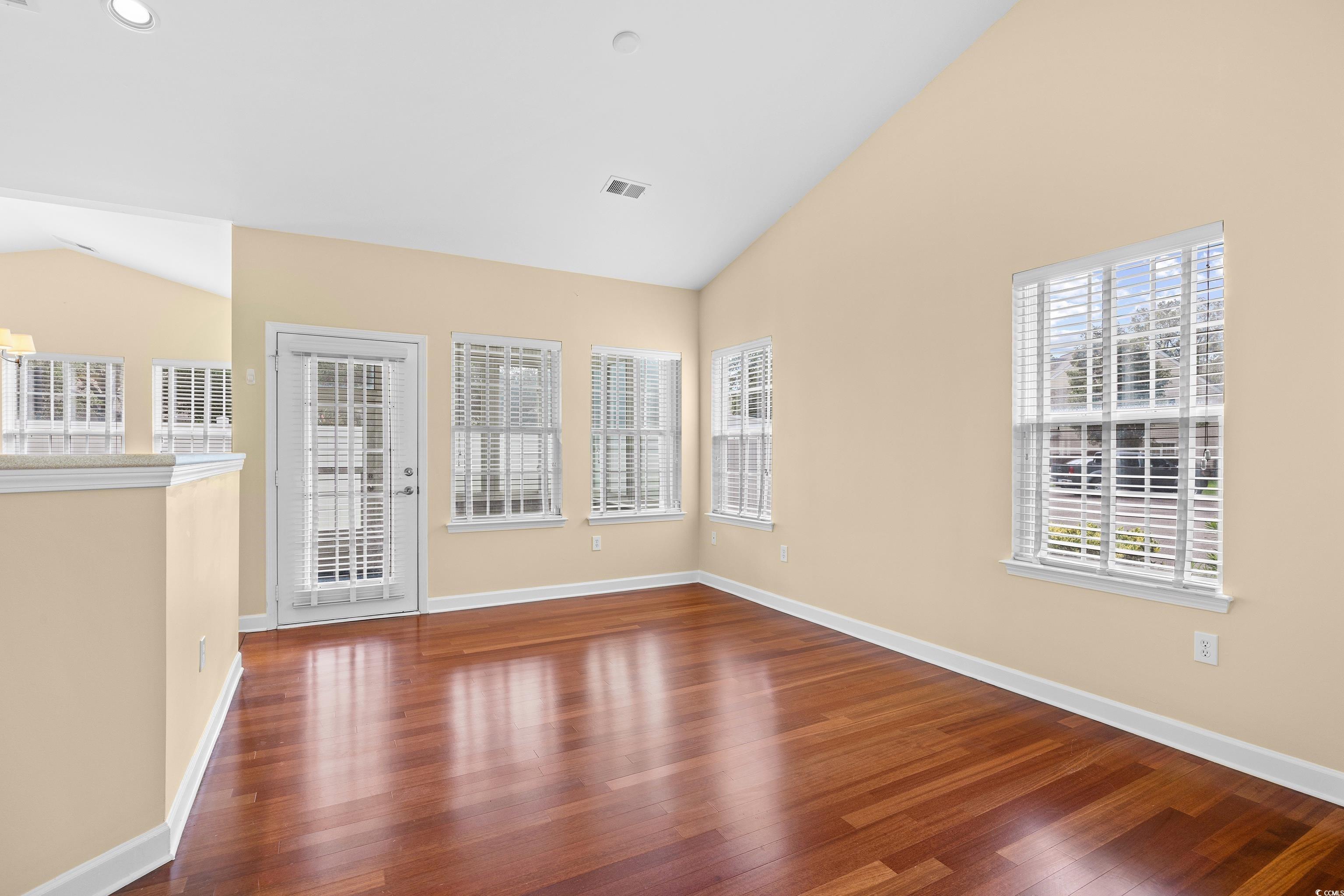 12-2 Rapture Court, Unit 2 Pawleys Island, SC 29585 - Photo 8 of 40 Empty room with wood finished floors, healthy amou