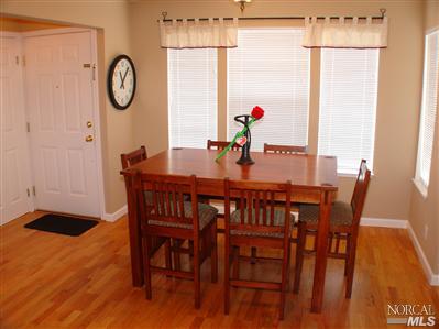 620 Ryan Lane Santa Rosa, CA 95407 - Photo 2 of 9 Dining area features custom red oak wood flooring, custom baseboards and moulding, and earth tone paint colors.