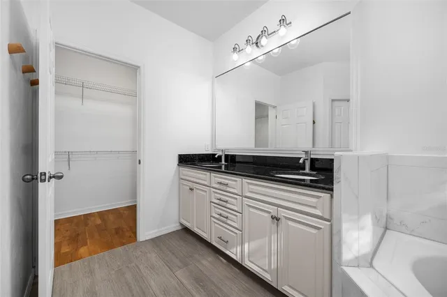 a kitchen with a sink and a refrigerator