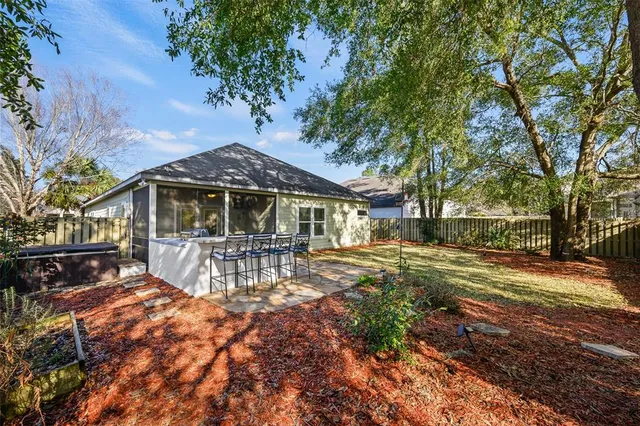 a view of house with outdoor space and garden