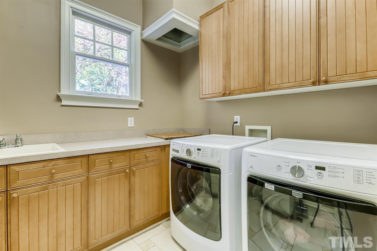 2646 Davis Street Raleigh, NC 27608 - Photo 12 of 30 First floor laundry is spacious and offers tons of storage.