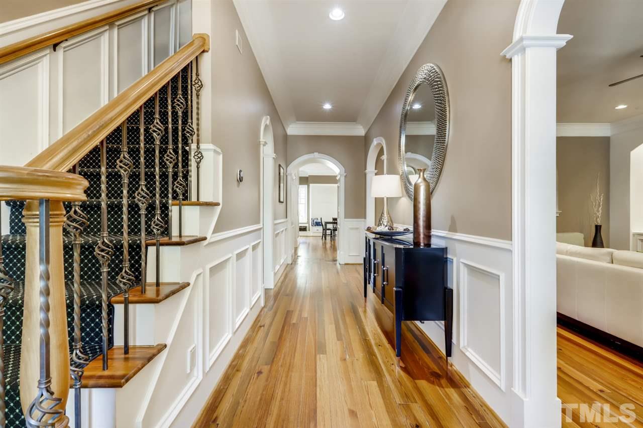 2646 Davis Street Raleigh, NC 27608 - Photo 3 of 30 Gleaming reclaimed pine floors and and abundance of natural light flow throughout the first floor.