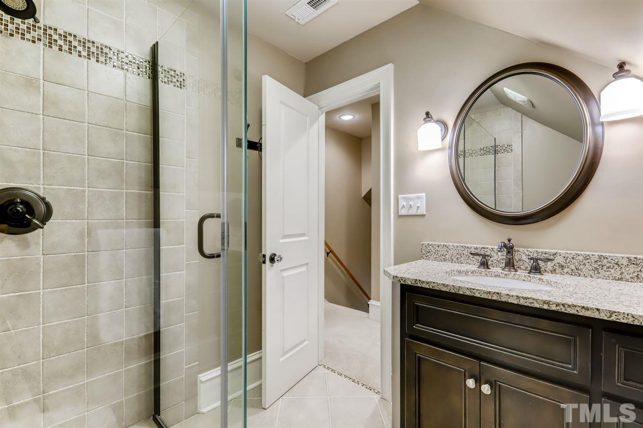 2646 Davis Street Raleigh, NC 27608 - Photo 24 of 30 Convenient third floor bath offers vanity and walk in shower.