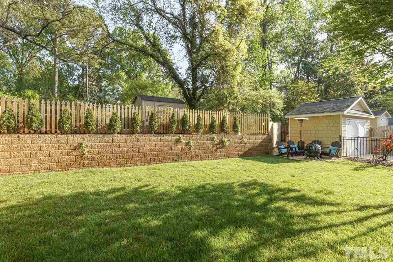 2646 Davis Street Raleigh, NC 27608 - Photo 29 of 30 Backyard features lush, green lawn and well manicured landscaping.