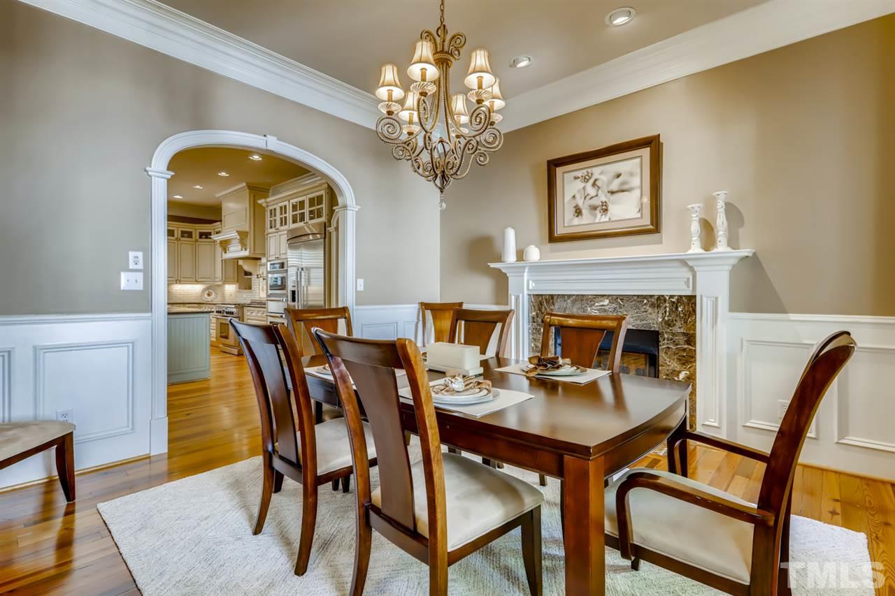 2646 Davis Street Raleigh, NC 27608 - Photo 4 of 30 Custom millwork and stately fireplace create the perfect ambience for dinner parties!