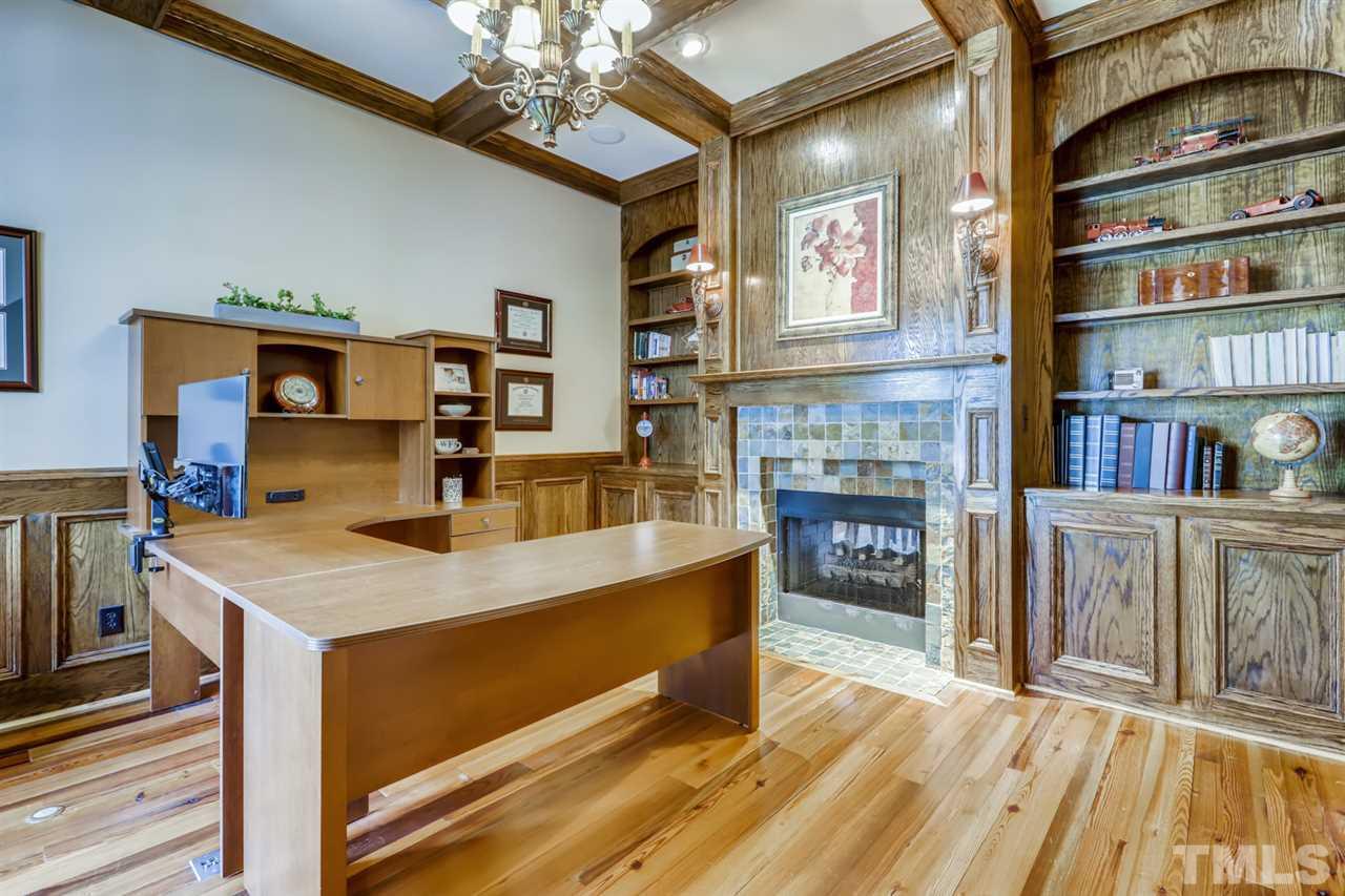 2646 Davis Street Raleigh, NC 27608 - Photo 5 of 30 Working from home never looked better. The magnificent fireplace and custom built ins bring the WOW factor!