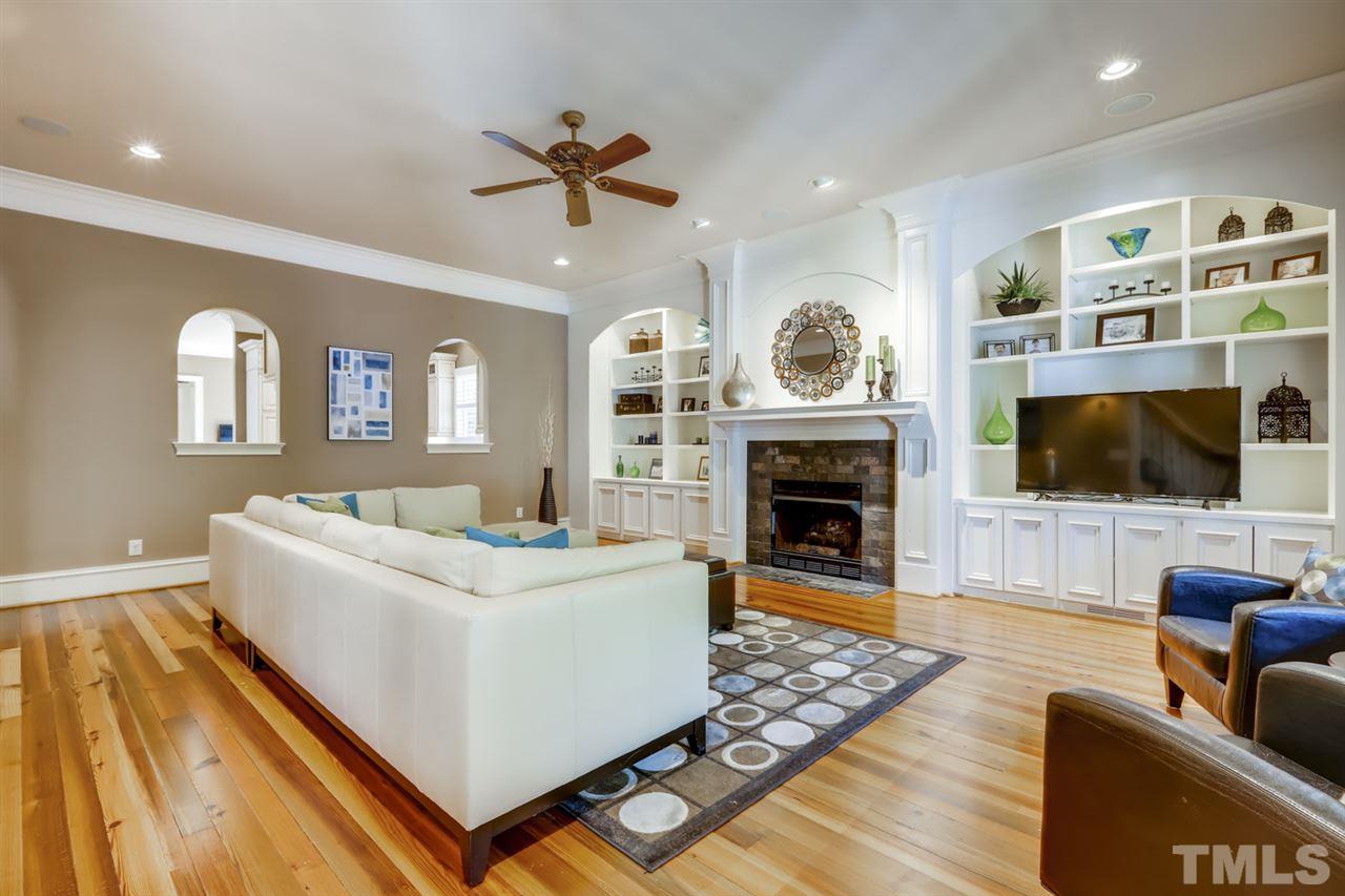 2646 Davis Street Raleigh, NC 27608 - Photo 7 of 30 Spacious room featuring MORE custom built-ins and ANOTHER fireplace is perfect for entertaining!