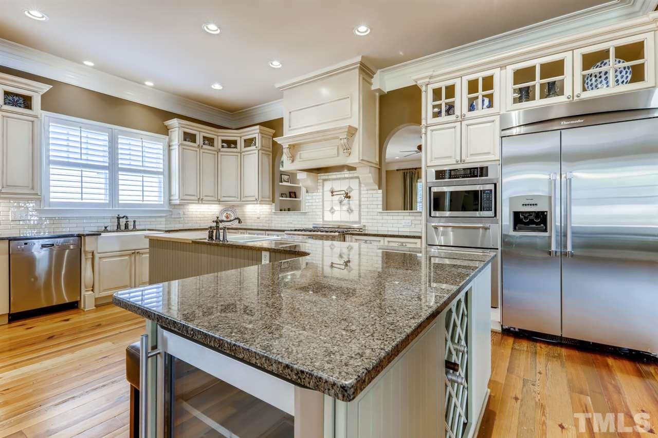 2646 Davis Street Raleigh, NC 27608 - Photo 8 of 30 Discerning home chefs will love all this gourmet kitchen has to offer -double ovens, warming drawer, and new beverage fridge.