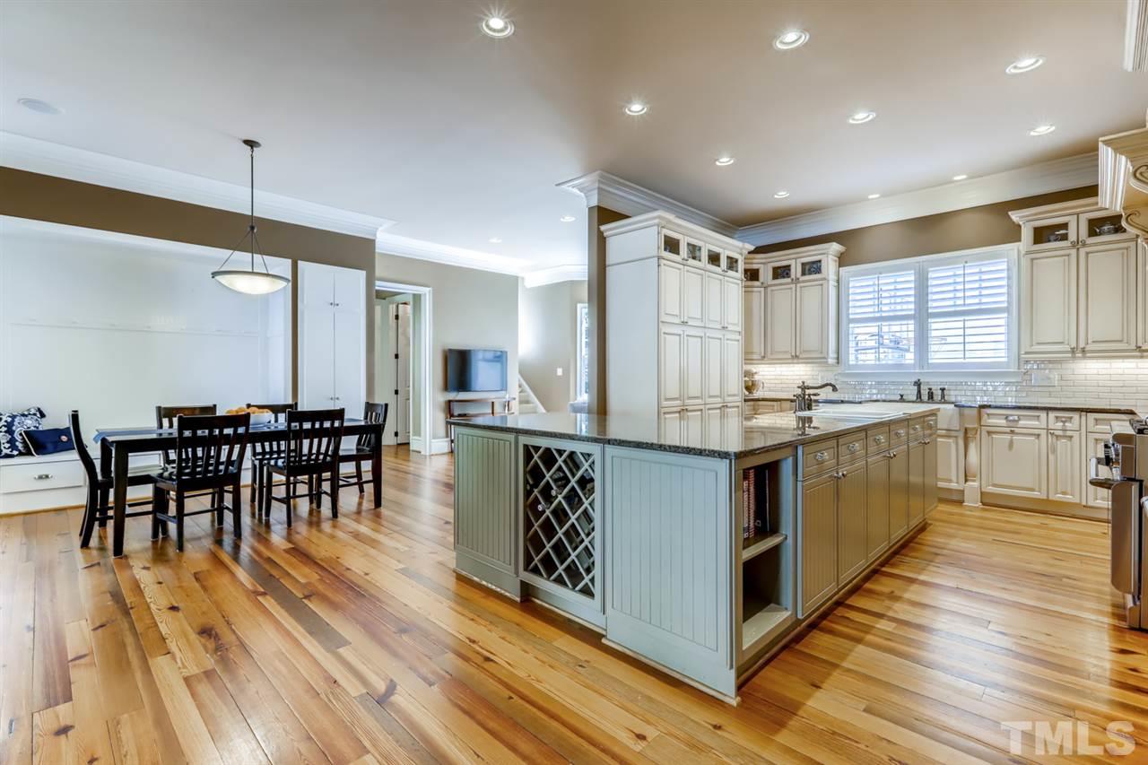 2646 Davis Street Raleigh, NC 27608 - Photo 9 of 30 Plenty of custom cabinetry and granite counterspace for all of your kitchen needs.