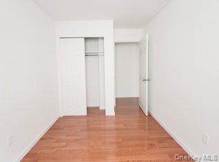 69-06 Beach Channel Drive Queens, NY 11692 - Photo 12 of 15 a view of an empty room with wooden floor