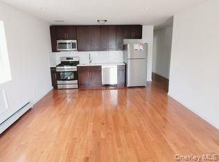 69-06 Beach Channel Drive Queens, NY 11692 - Photo 15 of 15 a kitchen with a refrigerator and a stove top oven