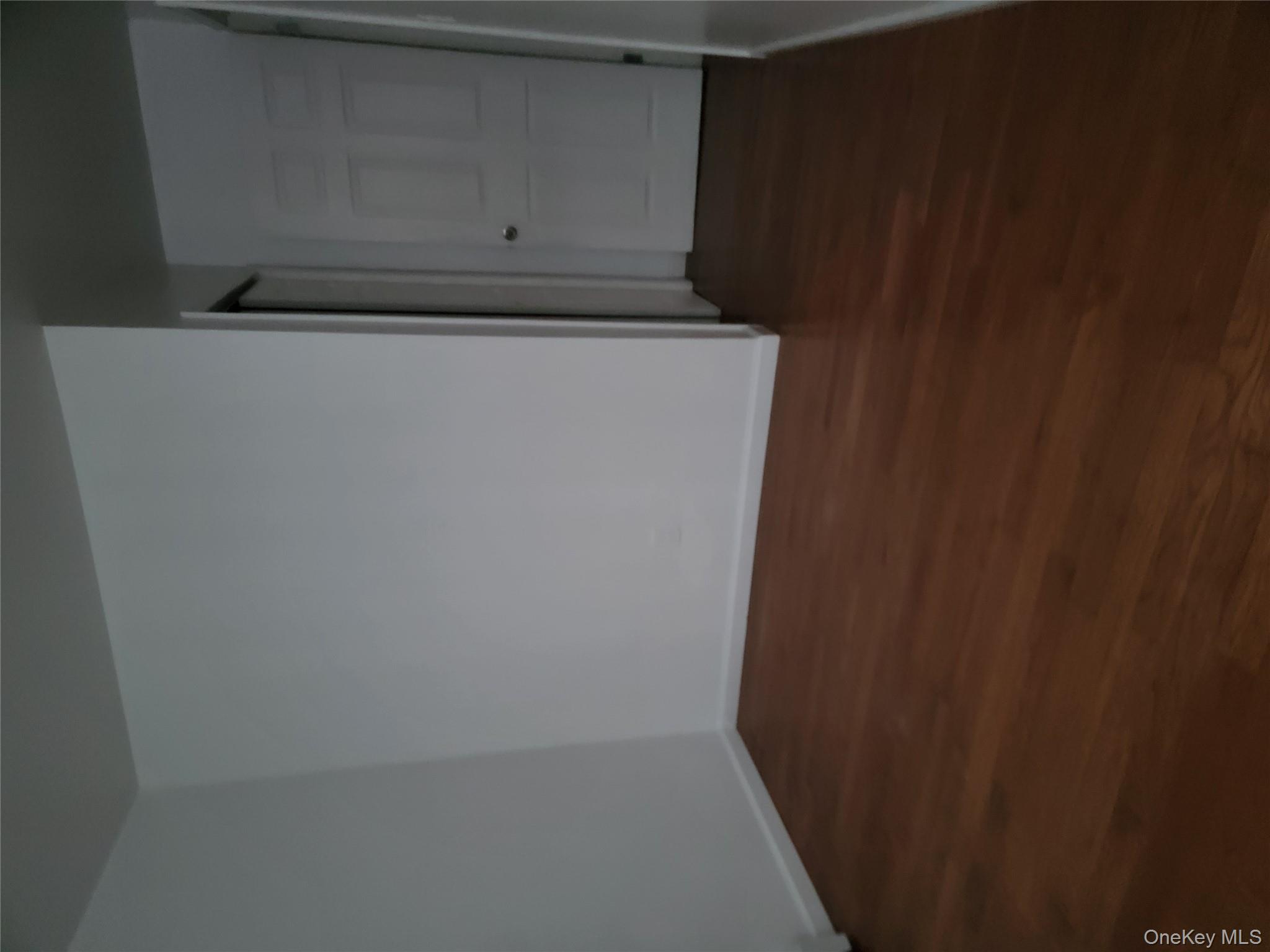 69-06 Beach Channel Drive Queens, NY 11692 - Photo 5 of 15 a view of wooden floor in a room