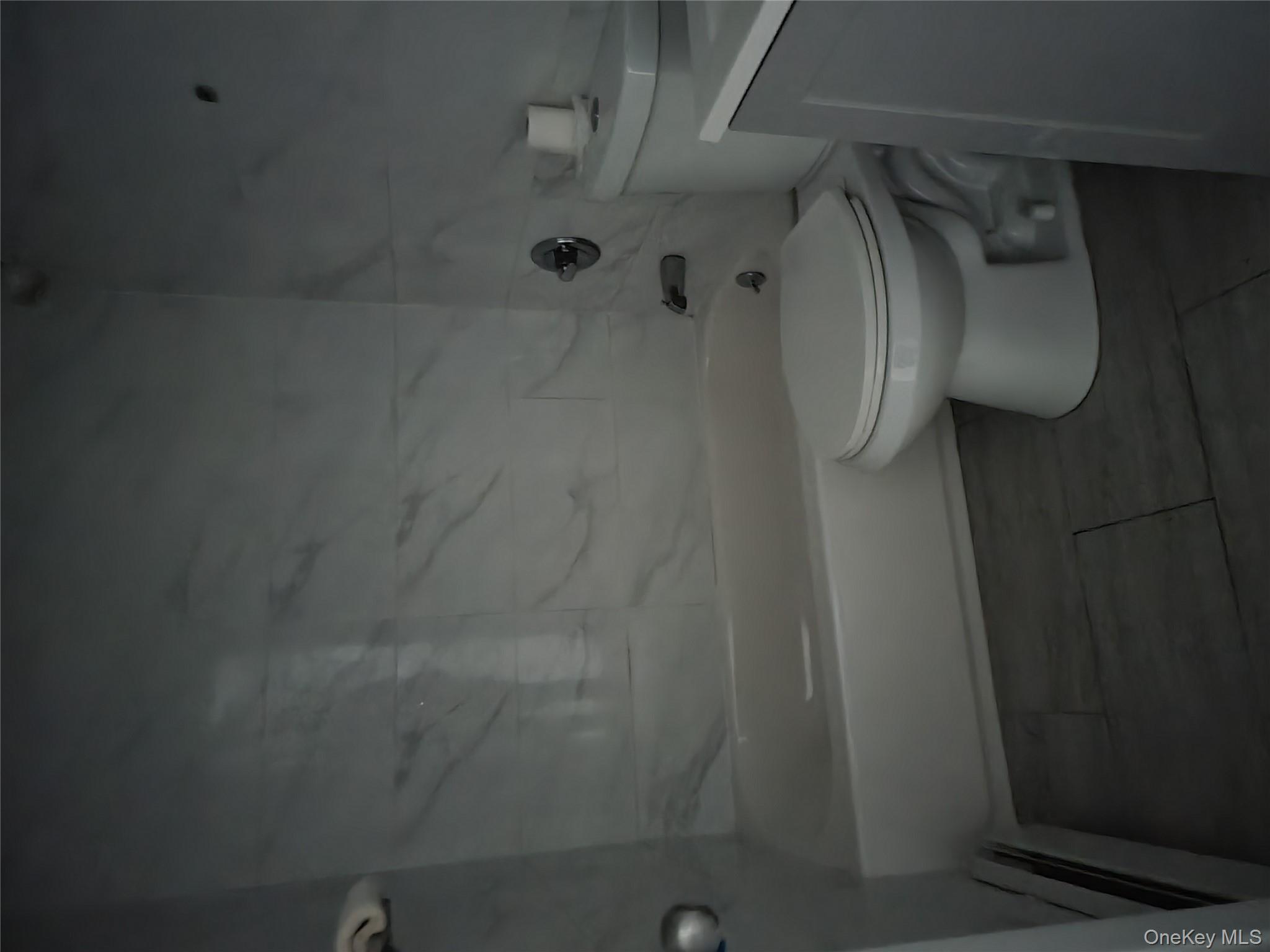 69-06 Beach Channel Drive Queens, NY 11692 - Photo 6 of 15 a bathroom with a toilet and a shower