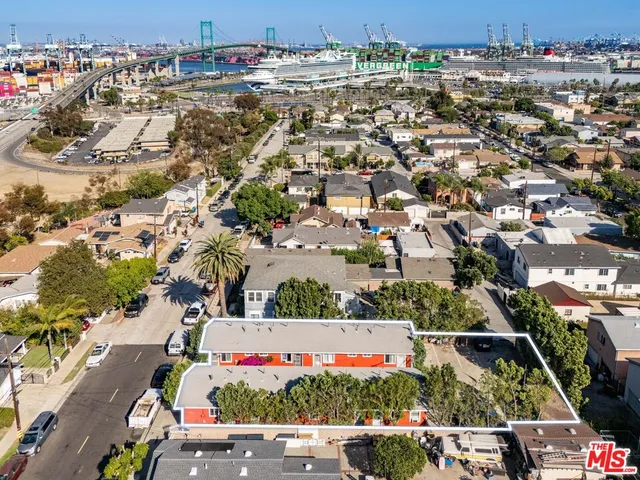 an aerial view of residential houses and car parked on street side