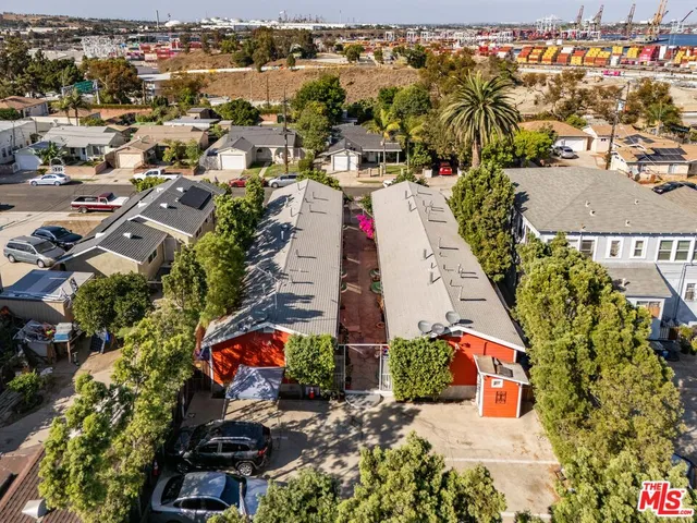 an aerial view of residential houses with outdoor space