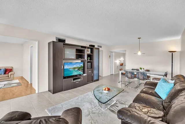 a view of a park with large trees