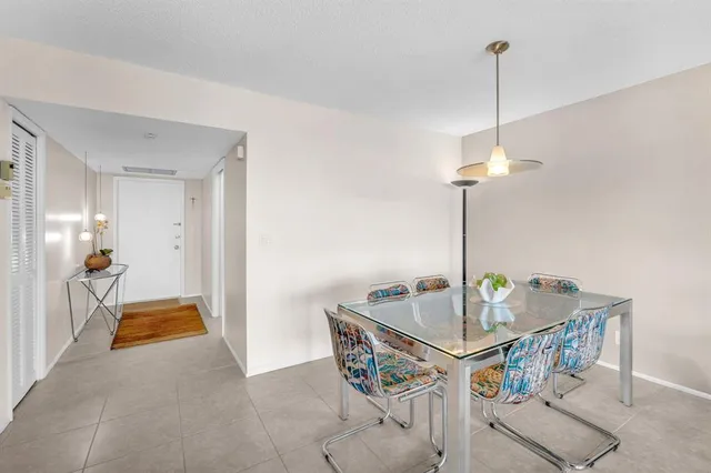 a view of an ocean and a building in the background