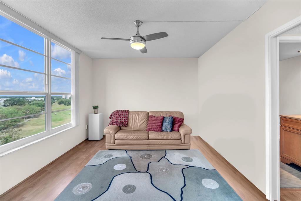 605 Oaks Drive, Unit 907 Pompano Beach, FL 33069 - Photo 20 of 41 a living room with furniture and a window