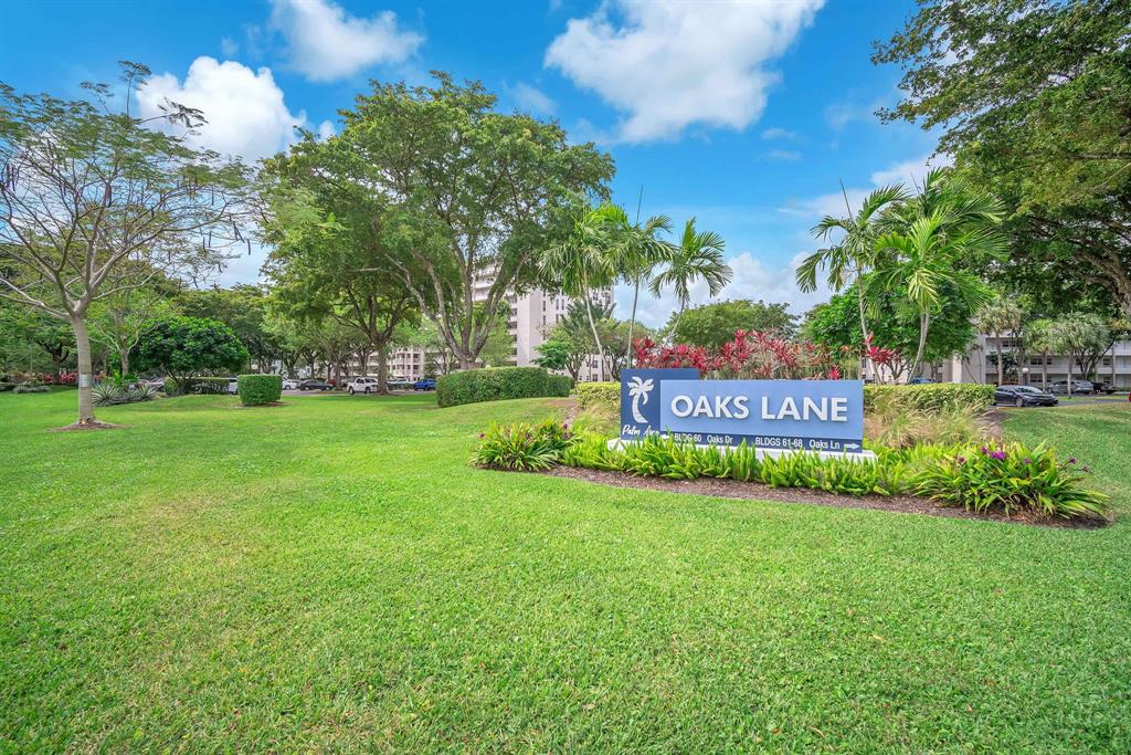 605 Oaks Drive, Unit 907 Pompano Beach, FL 33069 - Photo 26 of 41 a view of a park with large trees
