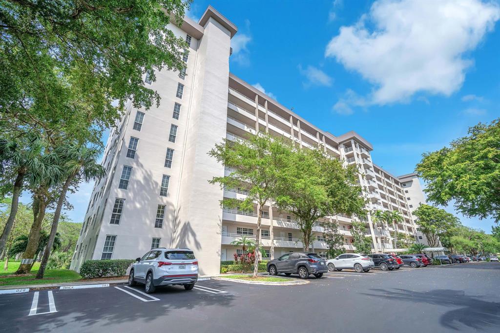 605 Oaks Drive, Unit 907 Pompano Beach, FL 33069 - Photo 28 of 41 a car parked in front of a building