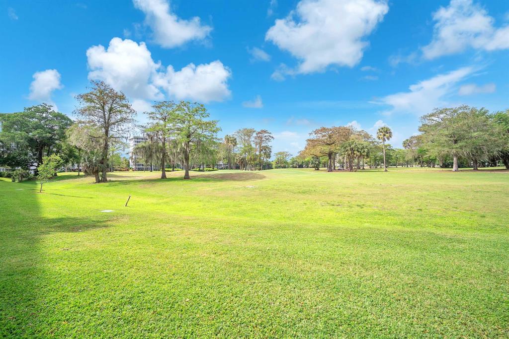 605 Oaks Drive, Unit 907 Pompano Beach, FL 33069 - Photo 30 of 41 a view of an ocean and a building in the background