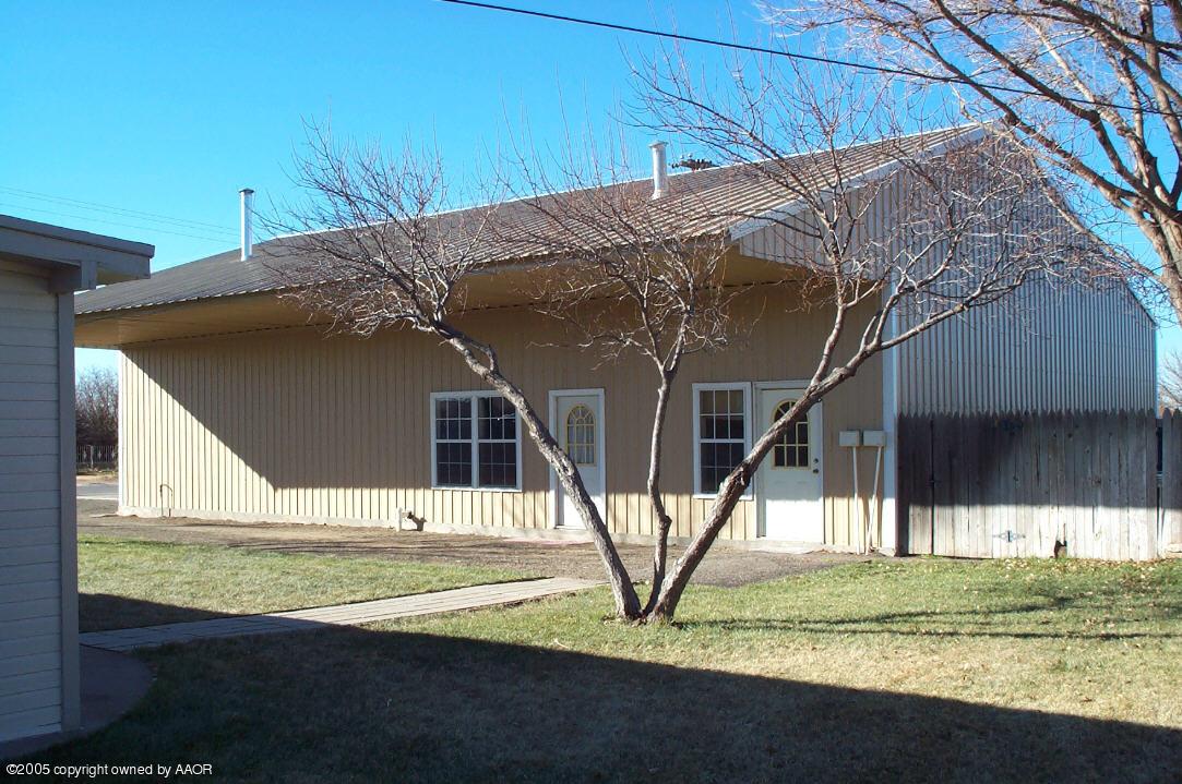 7922 Goodnight Trail Amarillo, TX 79110 - Photo 3 of 18 a view of a house with backyard and trees