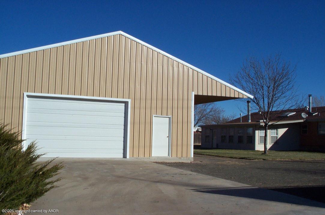 7922 Goodnight Trail Amarillo, TX 79110 - Photo 5 of 18 a view of a house with a garage