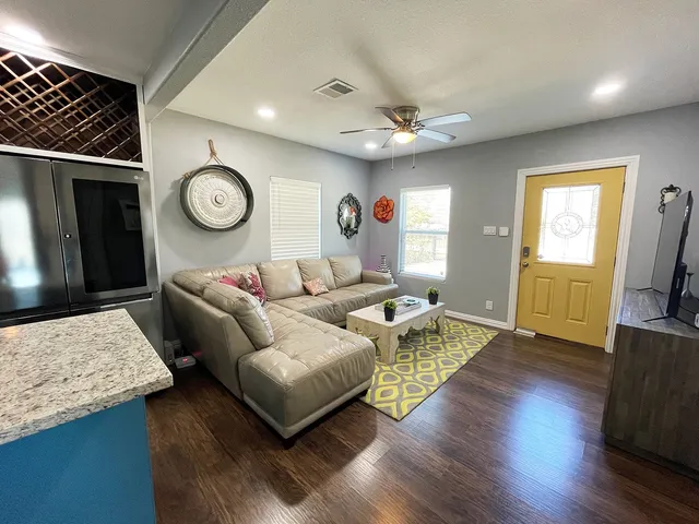 a living room with furniture and a large window