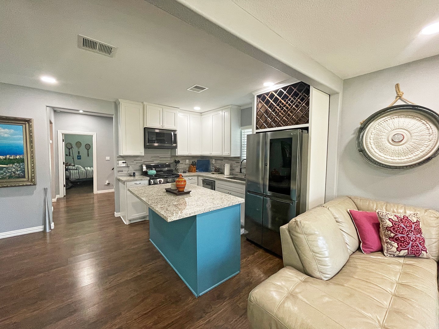 720 Caperton Street Houston, TX 77022 - Photo 13 of 25 a kitchen with stainless steel appliances granite countertop a refrigerator stove top oven and sink
