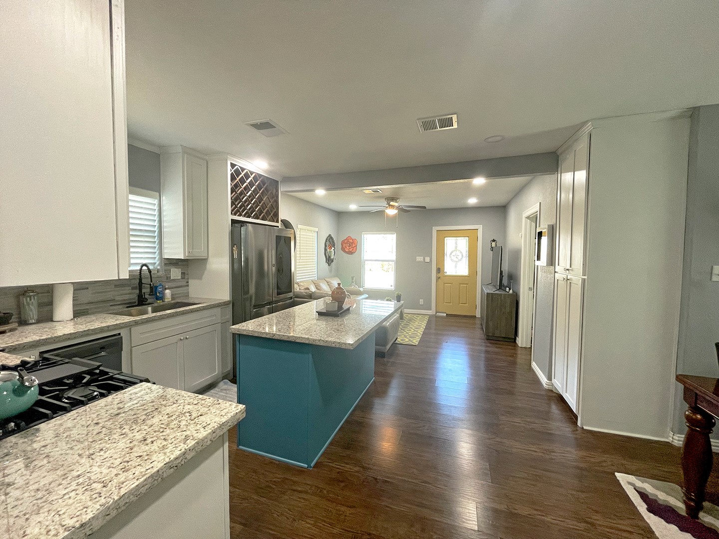 720 Caperton Street Houston, TX 77022 - Photo 14 of 25 a kitchen with a sink and a refrigerator
