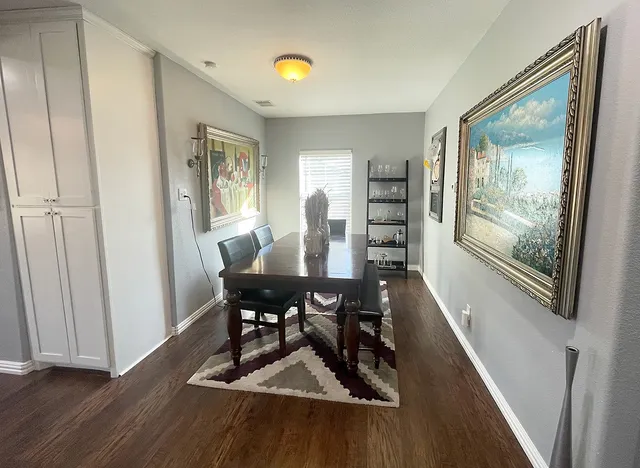 a view of a dining room with furniture window and wooden floor