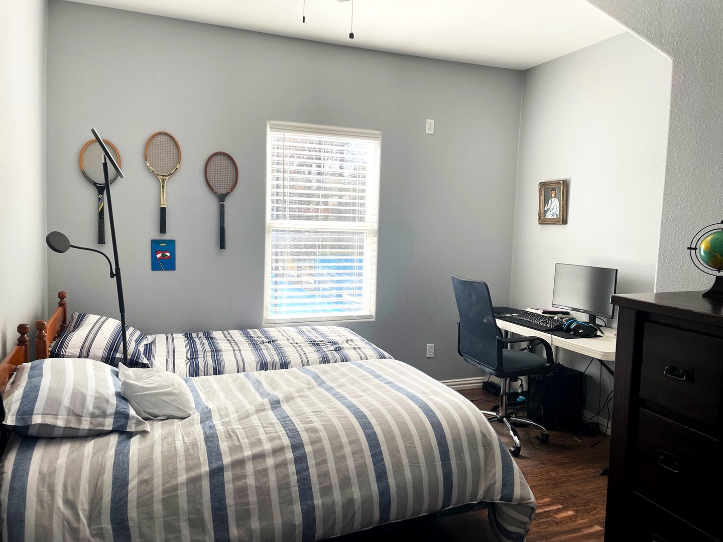 720 Caperton Street Houston, TX 77022 - Photo 21 of 25 a bedroom with a bed and a desk