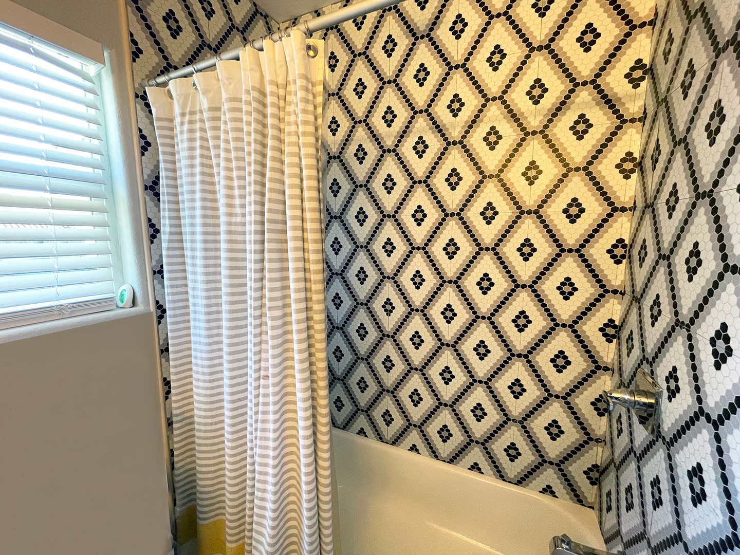 720 Caperton Street Houston, TX 77022 - Photo 23 of 25 a bathroom with a shower curtain